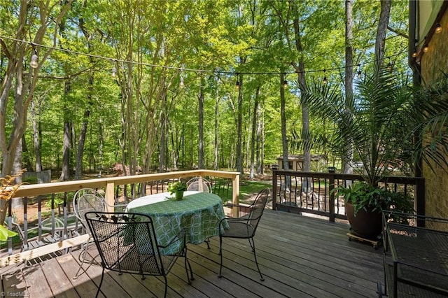 deck with outdoor dining space