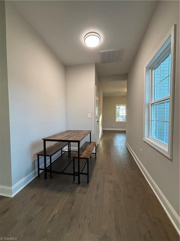 dining area featuring dark wood-type flooring