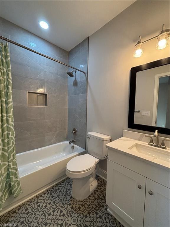 full bathroom featuring toilet, vanity, shower / tub combo with curtain, and tile patterned flooring