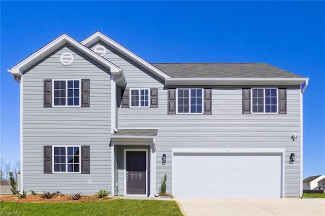 721 Brampton Dr, Mcleansville, NC 27301 - view of front of property with concrete driveway and an attached garage
