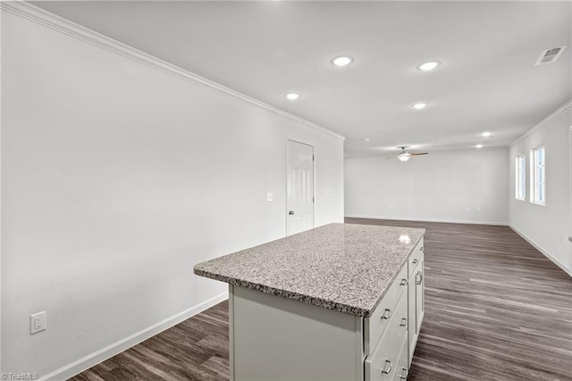 721 Brampton Dr, Mcleansville, NC 27301 - kitchen with crown molding, a ceiling fan, recessed lighting, white cabinets, and a center island