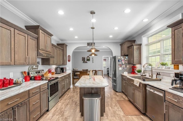 724-0 Tom Cook Rd, Pilot Mountain, NC 27041 - kitchen with appliances with stainless steel finishes, arched walkways, crown molding, under cabinet range hood, and recessed lighting