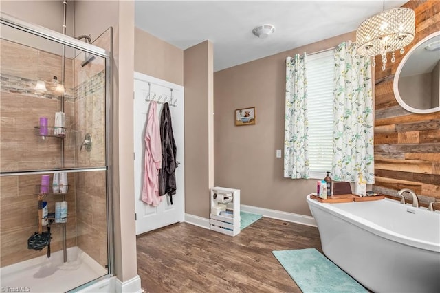 724-0 Tom Cook Rd, Pilot Mountain, NC 27041 - bathroom with a stall shower, a freestanding tub, wood finished floors, and a chandelier
