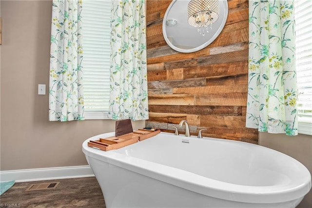 724-0 Tom Cook Rd, Pilot Mountain, NC 27041 - full bathroom featuring a soaking tub and wood finished floors
