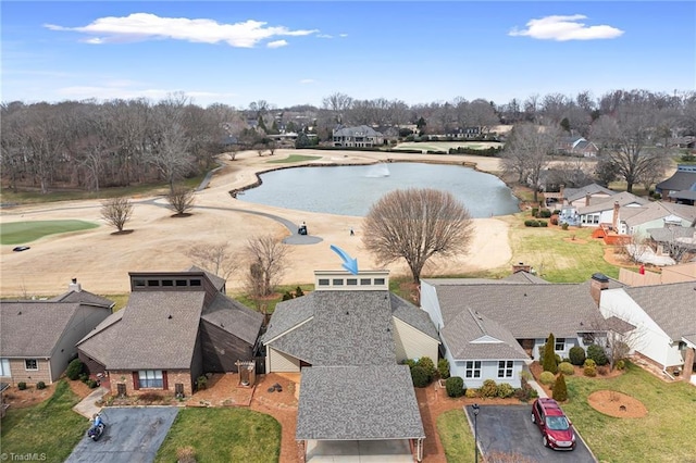 birds eye view of property with a residential view and a water view