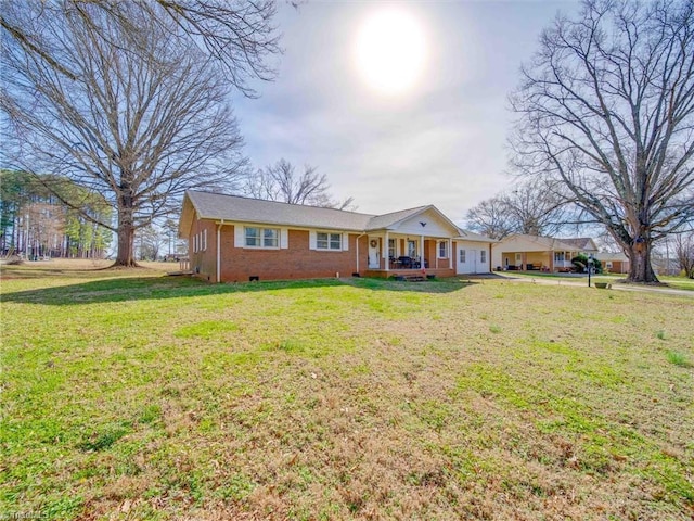 view of front of property with crawl space, a porch, a front lawn, and brick siding