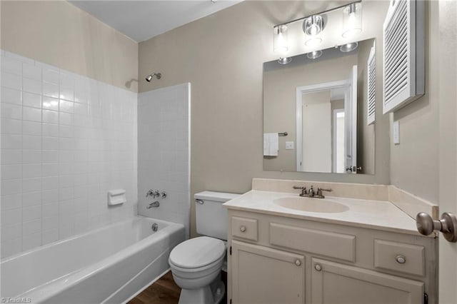 full bathroom featuring vanity, toilet, shower / tub combination, and wood finished floors