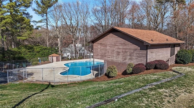 view of pool with a yard, fence, and a fenced in pool