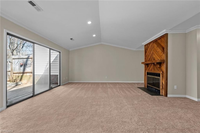 unfurnished living room with visible vents, light carpet, a large fireplace, crown molding, and lofted ceiling