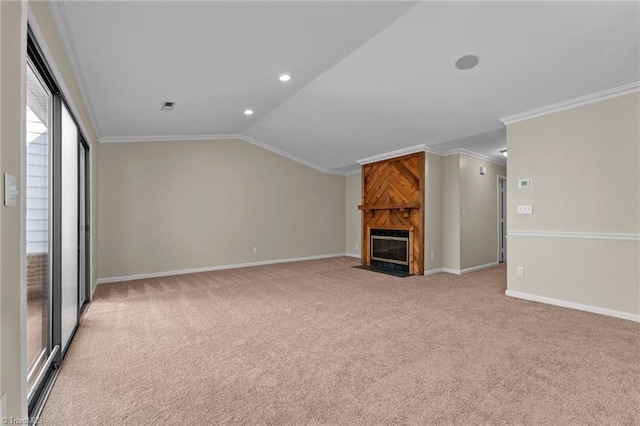 unfurnished living room with light carpet, a large fireplace, and ornamental molding