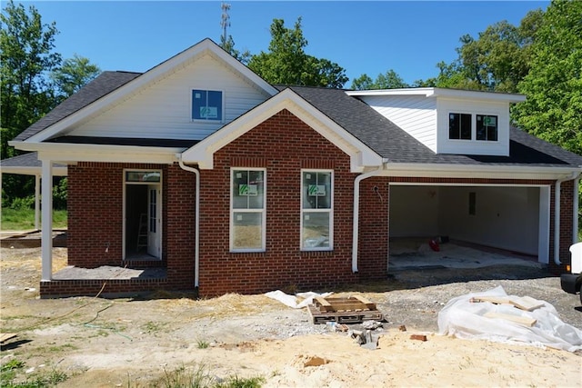 106 Ilex Ct, Yadkinville, NC 27055 - view of front facade with brick siding, an attached garage, and roof with shingles