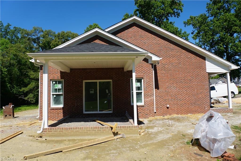106 Ilex Ct, Yadkinville, NC 27055 - rear view of house featuring brick siding