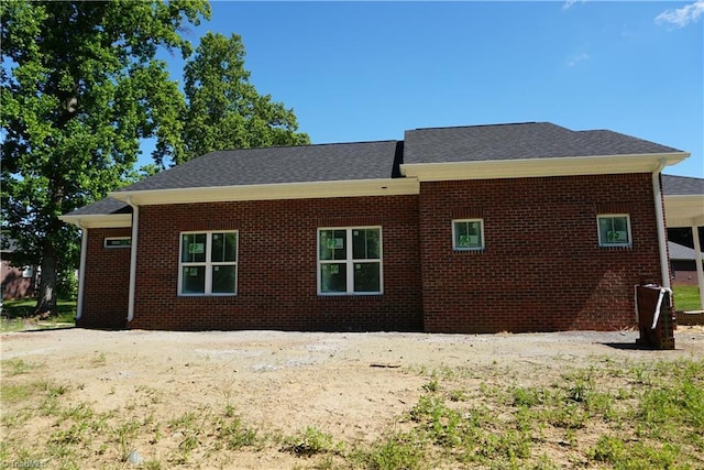 106 Ilex Ct, Yadkinville, NC 27055 - view of side of home with brick siding and a shingled roof