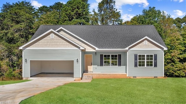 view of front of house featuring a front yard and a garage