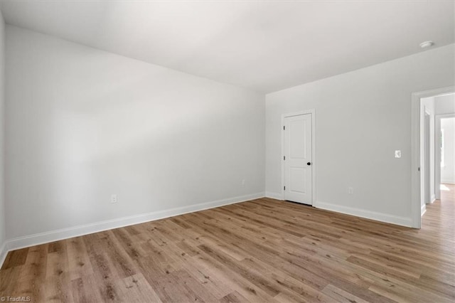 unfurnished room featuring light wood-type flooring