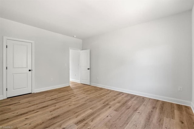 spare room with light hardwood / wood-style floors