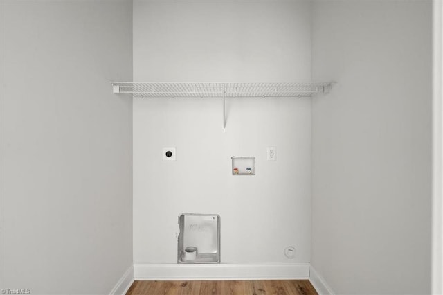 laundry area featuring hardwood / wood-style flooring, washer hookup, and hookup for an electric dryer