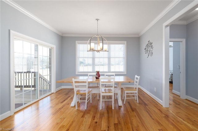 unfurnished dining area featuring crown molding, a healthy amount of sunlight, and light hardwood / wood-style flooring