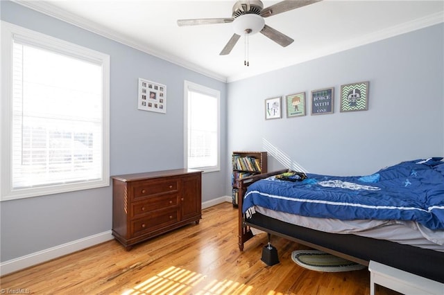 bedroom with ornamental molding, light hardwood / wood-style floors, and ceiling fan