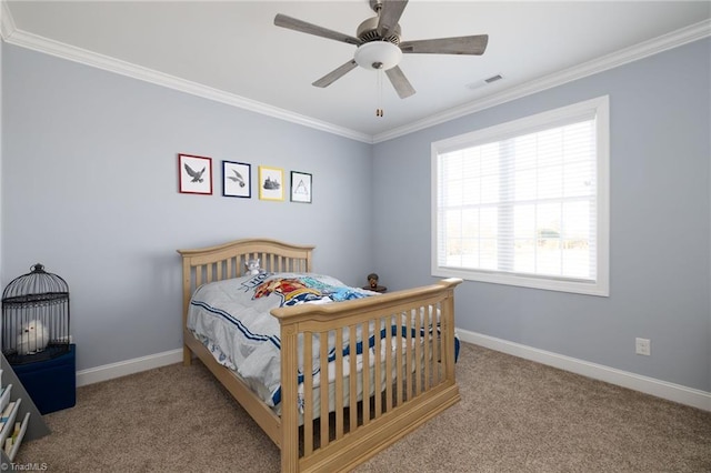 carpeted bedroom with ornamental molding and ceiling fan