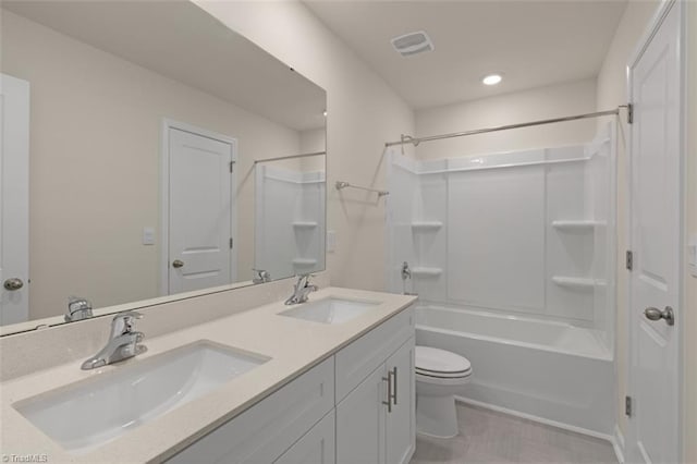 full bathroom with  shower combination, visible vents, a sink, and toilet