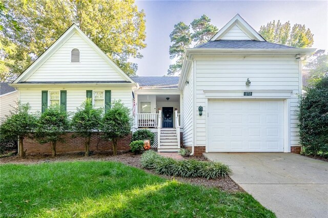 view of front of property featuring a garage and covered porch