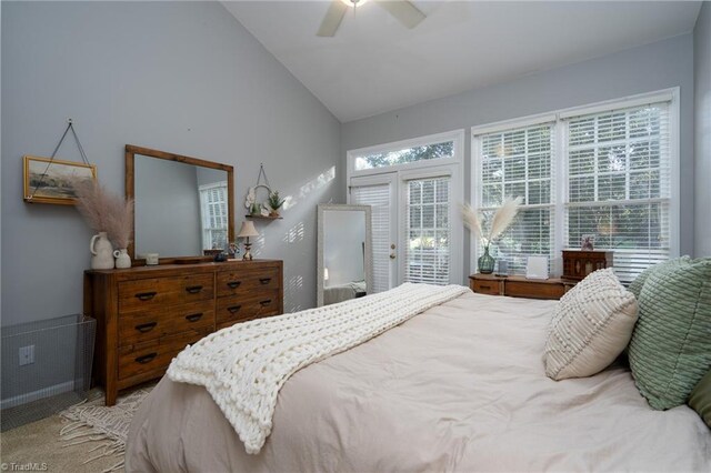 bedroom featuring carpet floors, access to exterior, vaulted ceiling, and ceiling fan