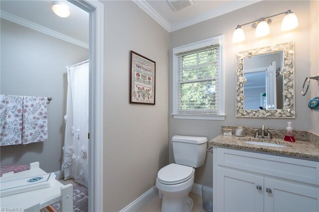 bathroom featuring vanity, crown molding, toilet, and tile patterned flooring