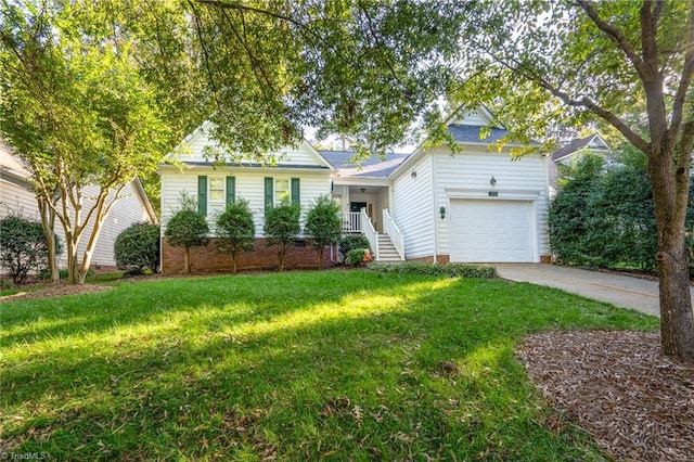 view of front of home with a front yard and a garage