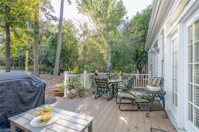 wooden deck featuring grilling area