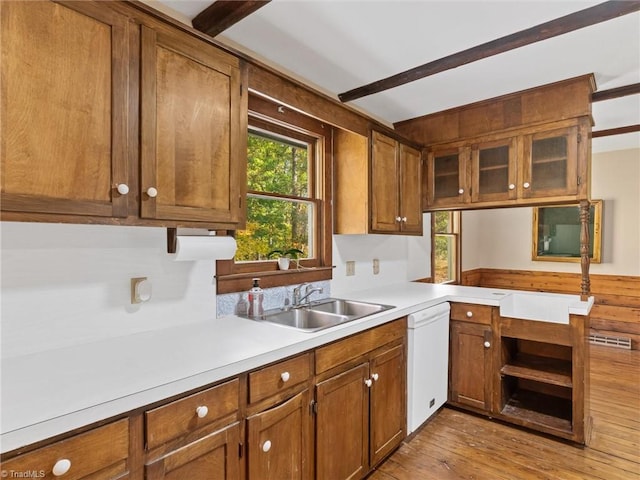 kitchen featuring light hardwood / wood-style floors, white dishwasher, and sink