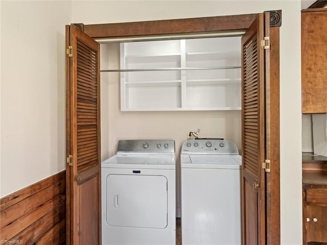 laundry area featuring washing machine and clothes dryer