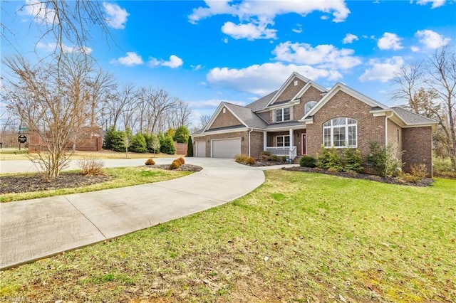 view of front facade with an attached garage, concrete driveway, brick siding, and a front yard