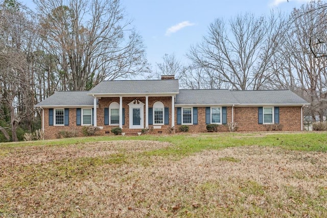 single story home with a front yard