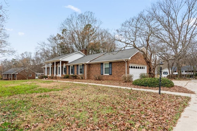 ranch-style home with a front yard and a garage