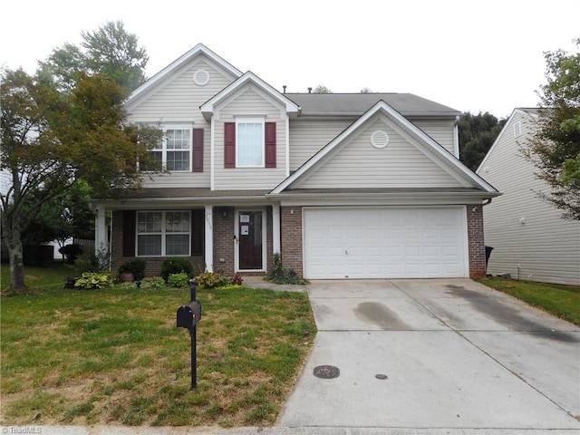 view of property featuring a garage, a front lawn, and covered porch