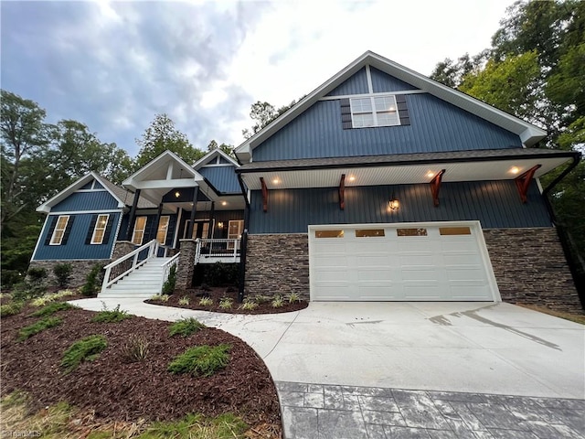 view of front of home with a garage and a porch