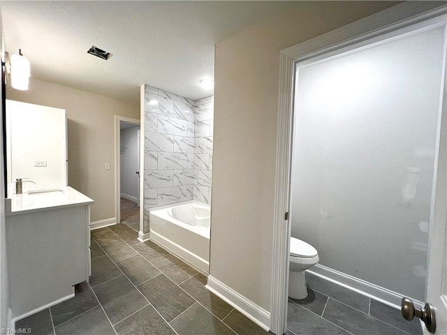 bathroom featuring vanity, tile patterned flooring, and toilet