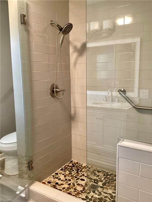 full bath with a shower stall and toilet