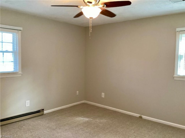 empty room featuring baseboards, carpet floors, baseboard heating, and ceiling fan