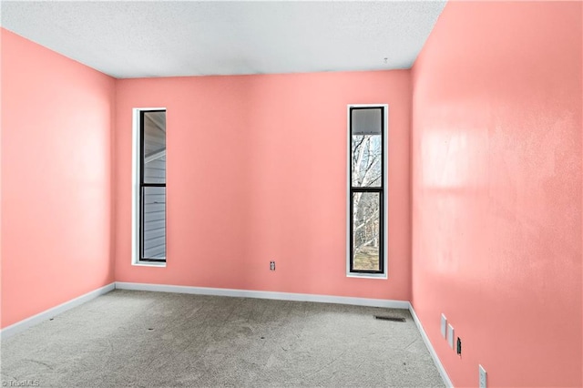 empty room with carpet flooring