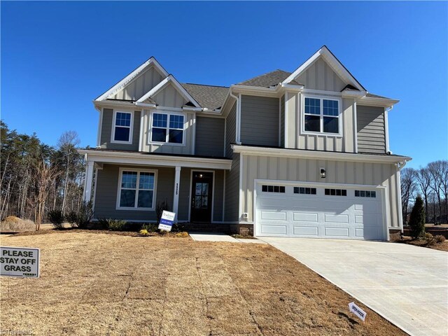 craftsman house featuring a porch, concrete driveway, a garage, and board and batten siding