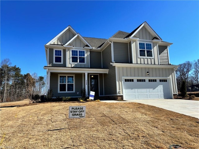 view of front of house featuring driveway, covered porch, board and batten siding, and an attached garage