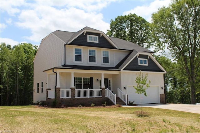 craftsman-style house featuring a porch, a front lawn, and a garage