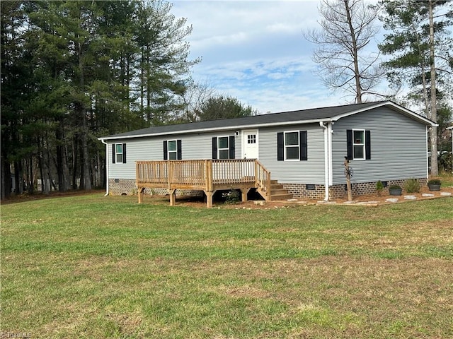 view of front of house with a front lawn and a wooden deck