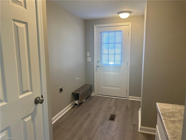 doorway to outside with hardwood / wood-style floors