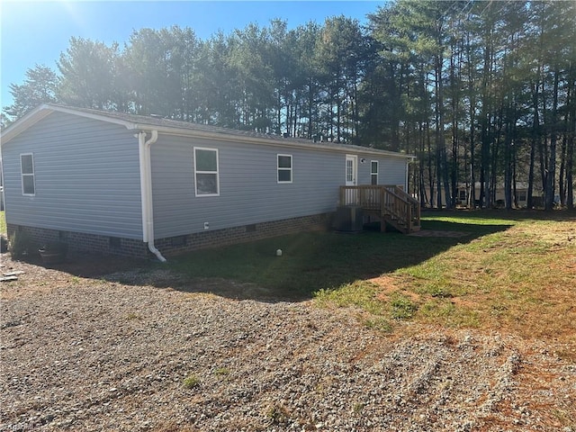 back of house featuring a lawn