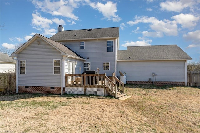 back of house featuring crawl space, a wooden deck, a lawn, and fence