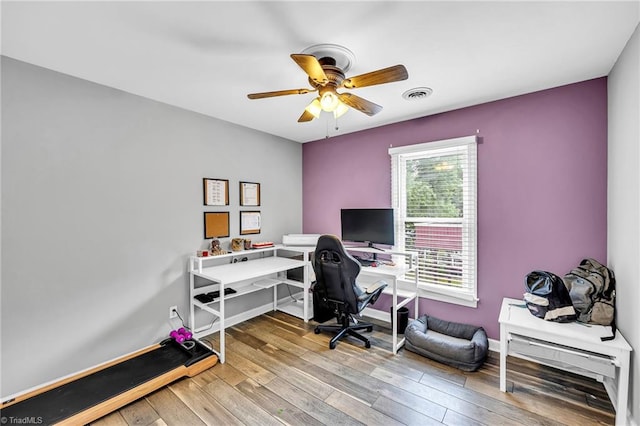 office featuring wood-type flooring and ceiling fan