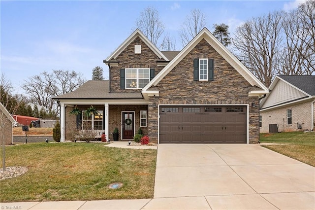 craftsman-style house featuring covered porch and a front lawn